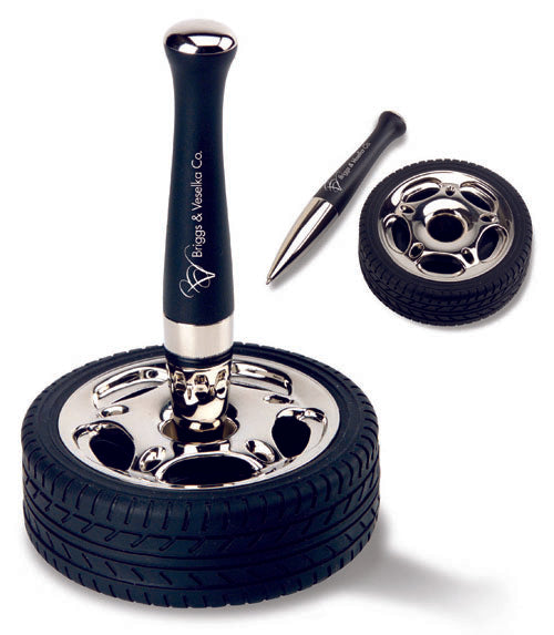 Pen Stand In A Rubber Tire Base Floating Pen Inserted In Shiny Chrome Hub
