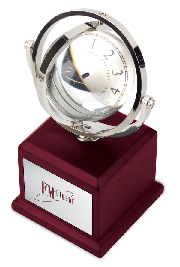 Rotating Mag-globe Clock Sits On Mahogany Wood Finish
